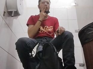 Smoking inside a public toilet