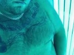 Hairy tattooed daddy with big cock cums on the sunbeds