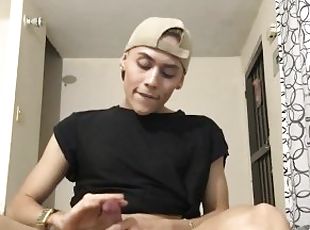 Latin twink teasing ass and stroking his pecker indoors