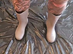 CrazyFetishCouple - German MILF in rubber boots pees in the living room