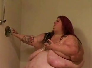 Super fat tattooed chick takes a hot shower