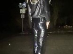 Crossdressing femboy sissy at public parking lot with buttplug and in latex leggings